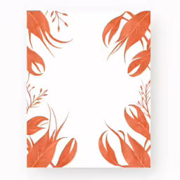 a small square card with leaves in orange