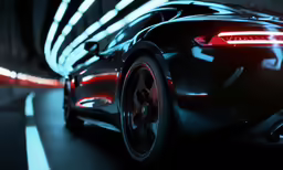 a black sports car on the road with red and white stripes