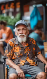 a man with a grey beard is sitting in a wheel chair