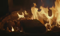 fire burning on a firewood in a fireplace