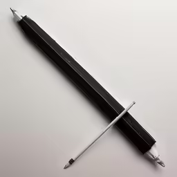 an unlined fountain and pencil on white table