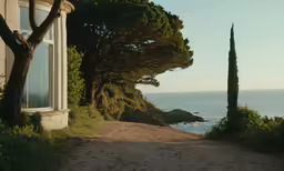 a very pretty road with a bench next to it