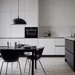 white and black modern kitchen with large dining table