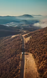 this is an aerial view of a long road