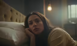 an image of a woman that is laying down on the bed