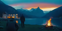 two people standing in front of a fire
