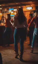 a women standing in a room with some people