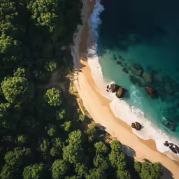 an aerial view of some rocks and a beach in the middle of the ocean