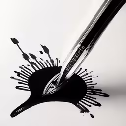 there are black ink on a white surface