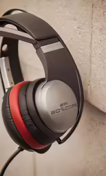 the headphones with an electric cord on top of it