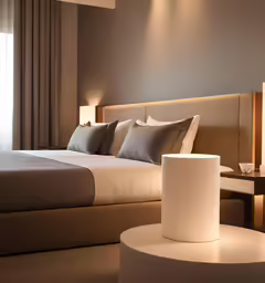 a very clean bedroom with a bed and chair