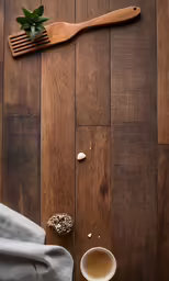 a wooden table with some spoons and a cup