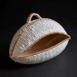 a basket made from woven thread with an oval shape