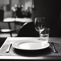 the plate and glass are sitting on the placemat