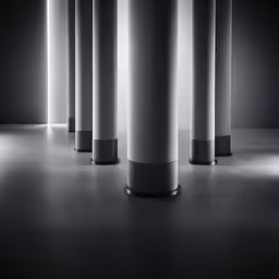 a bunch of tall columns in a room
