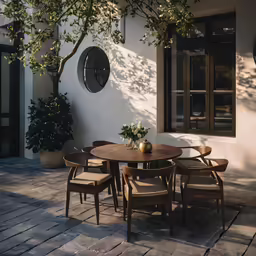a round table sitting on the side of a building
