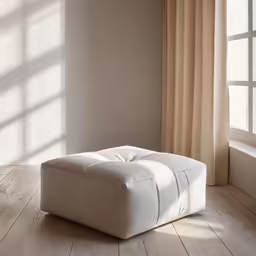 a white foot stool in front of window