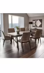 this table and chairs are arranged in the middle of the room