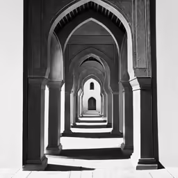 archways of an ancient mosque of oman in black and white