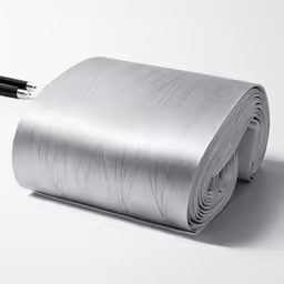 a silver piece of paper with a black pen