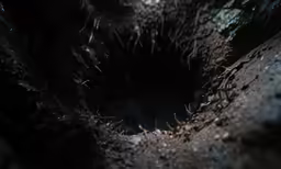 a closeup photo of a dark hole
