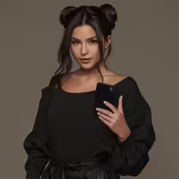 a woman in black is posing for a photograph