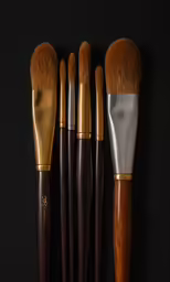 a collection of makeup brushes are arranged in three rows