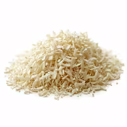 closeup of some white rice on a white table