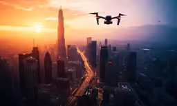 a quad engine propeller flying over an urban area