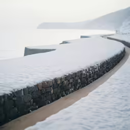 a walk way and a sidewalk in the snow