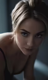 a woman with very big eyes and no hair is looking into the camera