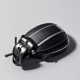 a black and silver device with a button