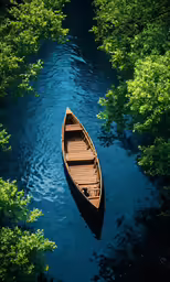 an empty wooden boat floating in the blue water