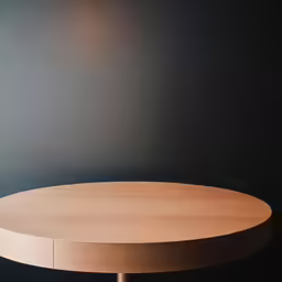 a round table on an oval stand