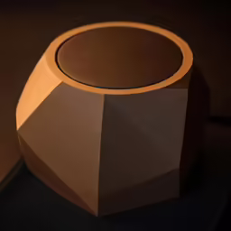 an unusual wooden speaker sitting on top of a table