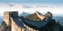 a bird sits atop the side of the great wall
