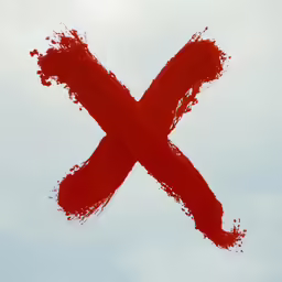a large red painted letter that has been made into the shape of a x