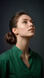 a woman with her eyes closed is looking up