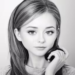 a young lady posing with a black and white photo