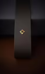an interesting tie sitting on the ground in a room