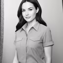 a woman is wearing a button up shirt