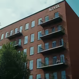 the windows of the building have balconies