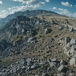 a landscape photo of some rocks on the side of a mountain