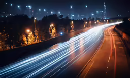 a view of an empty highway at night with long exposure