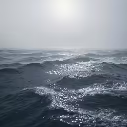dark blue ocean waves with light reflections on the water
