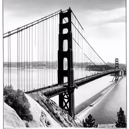 a tall bridge spanning the width of the water