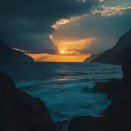 the sun sets behind the mountain on a beautiful day