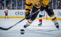 a hockey player wearing yellow jersey skating on an ice