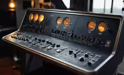 an old control panel with several buttons and knobs