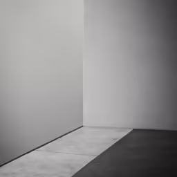 a person in a room with the wall facing the side